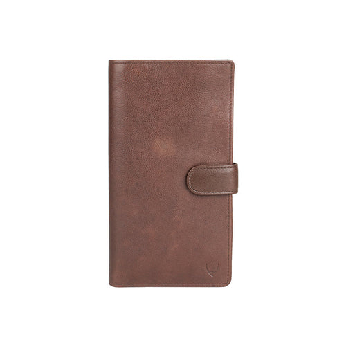 Brown leather passport holder with secure flap closure, designed for travel essentials by Hidesign.