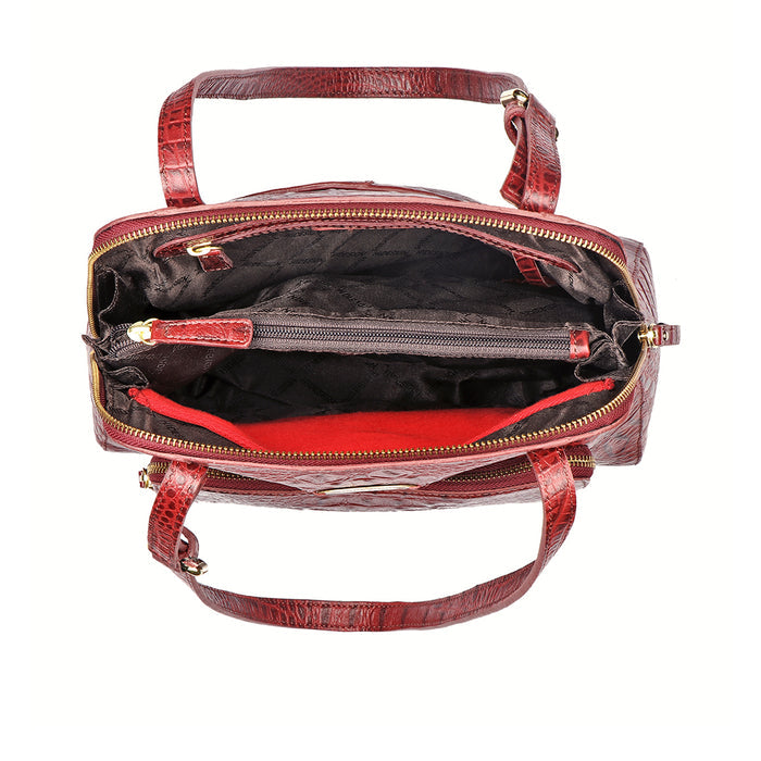 Top view of a red crocodile-texture leather Hidesign tote bag showing compartments & zipper pockets.