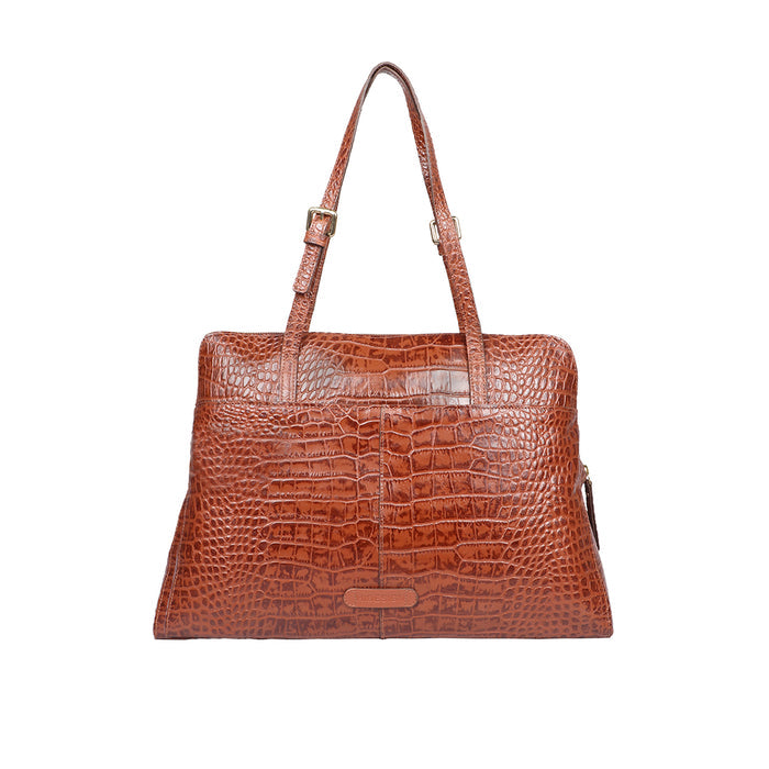 Reverse view of tan croc-embossed leather tote with adjustable shoulder straps and clean finish.
