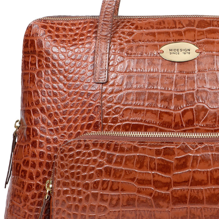 Elegant tan croco-embossed leather tote bag with front zip pocket, gold-tone logo, and top zipper.