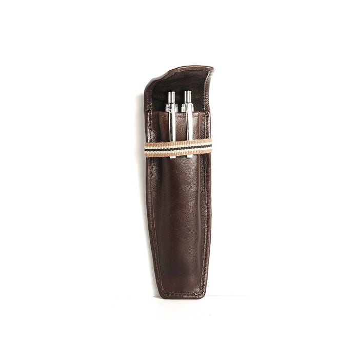 Showcasing a brown leather key chain with a striped band, holding 2 metal key tools in a slim case.