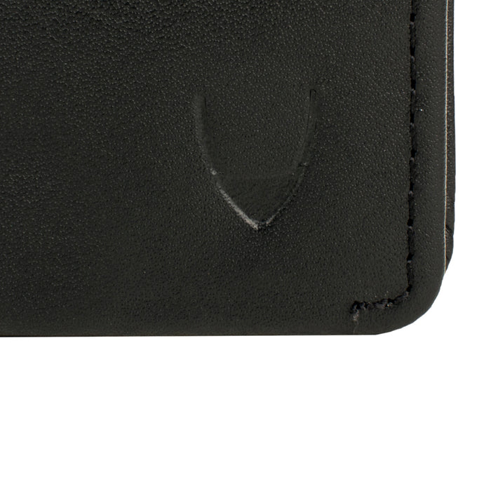 Close-up of a black leather wallet with a subtle curved embossed logo beside a stitched corner edge.