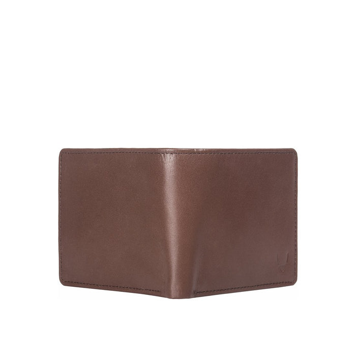 Outer view of a tan leather bi-fold wallet, highlighting smooth interior panels and neat stitching.