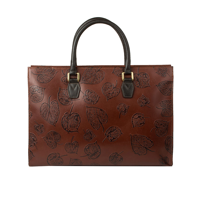 Back view of Hidesign Kester women's brown leather laptop bag with embossed leaf pattern & handles.
